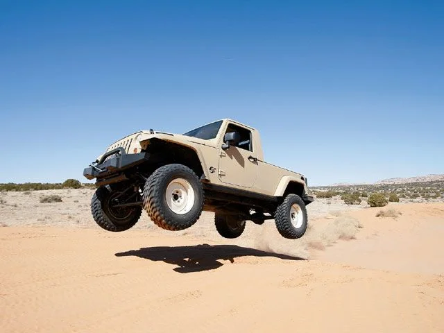 129_0808_12_z+concept_4x4_trucks_moab+jeep_jt_jump.webp