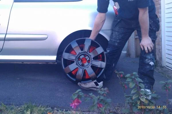 black_alloy_against_car.webp