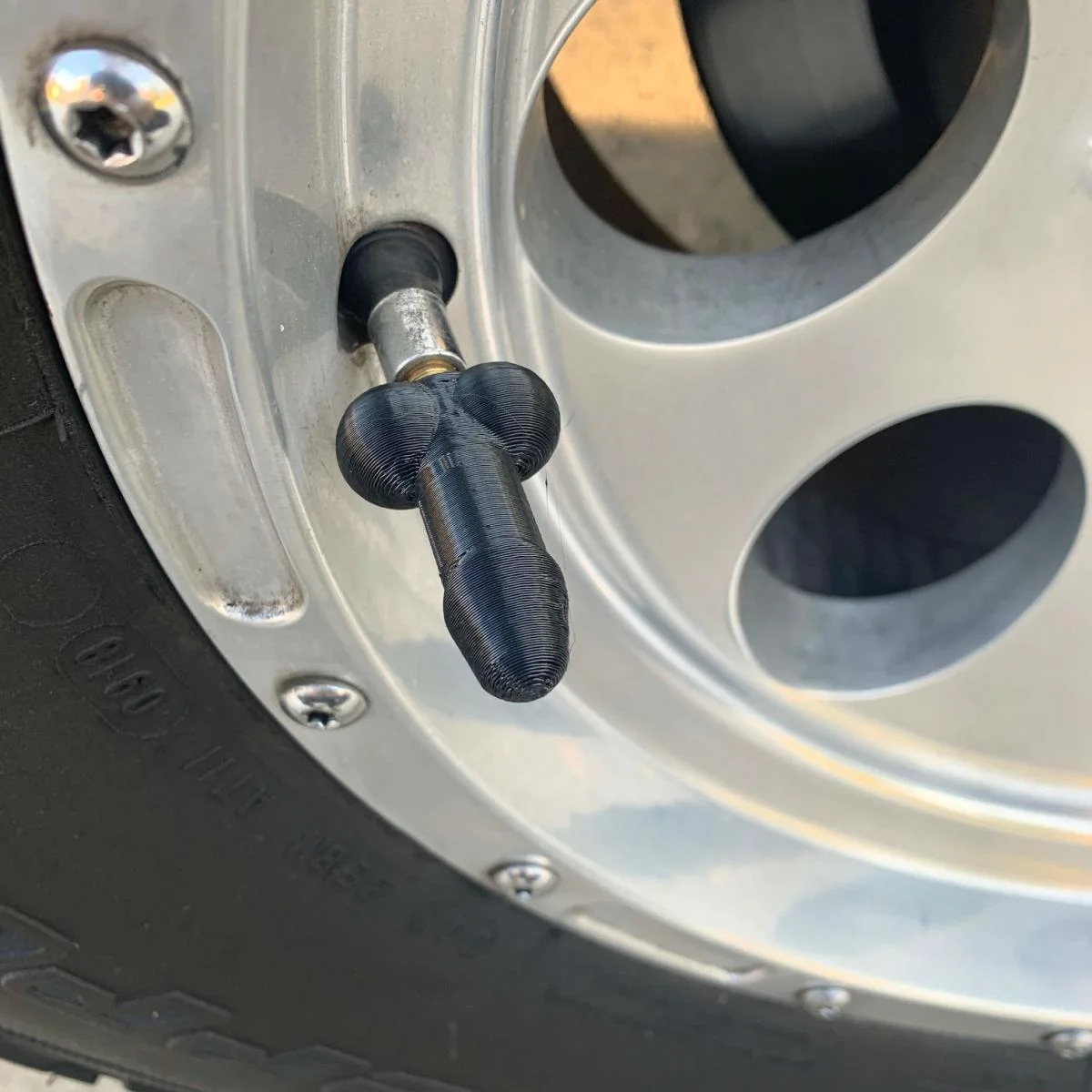 prank-wiener-shaped-tire-valve-stem-caps-6806.webp
