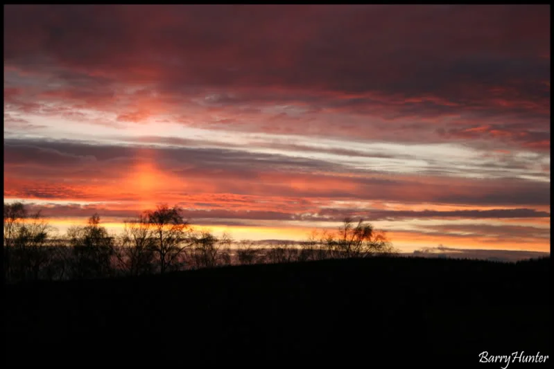 Sunsetoverstonehaugh.webp