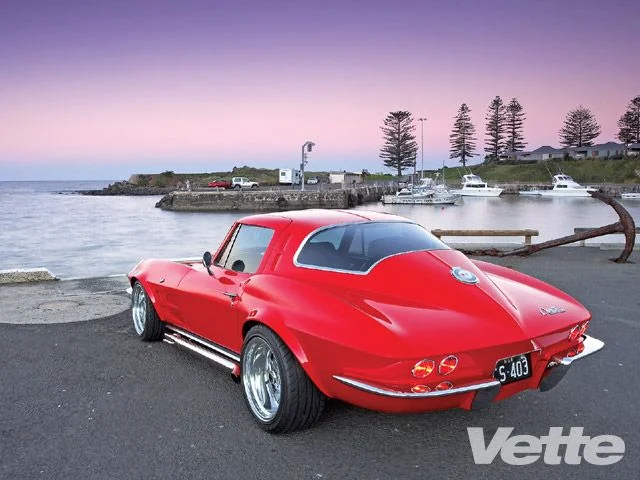 vemp_0909_03_z+1963_chevrolet_corvette_stingray_coupe+rear_left_view.webp
