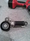 CLIO F4R AUXILLARY BELT TENSIONER with hoseclip.webp