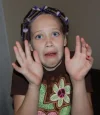 Sydney+in+curlers+with+nails+scared+look.webp