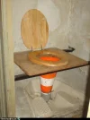 white-trash-repairs-toilet-under-construction.webp